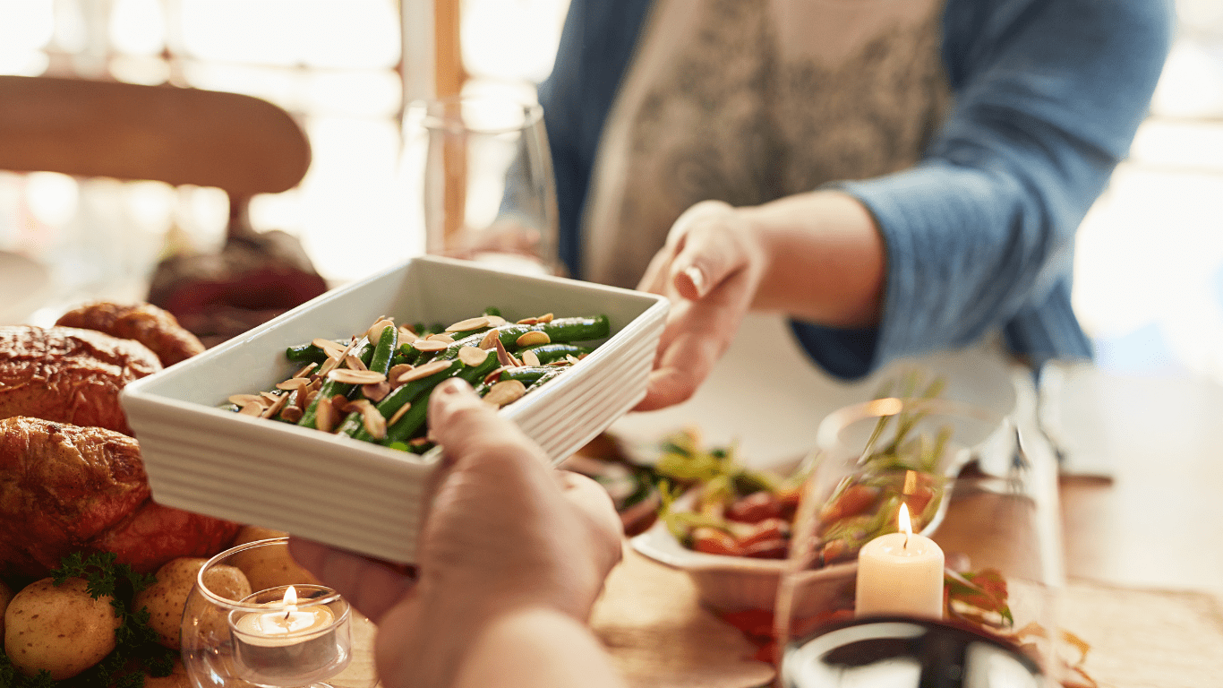 diverse group of people sharing a nutritious meal at a table, symbolizing the importance of healthy eating and community support.